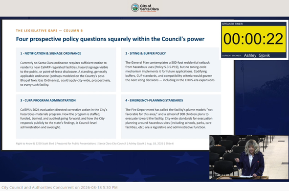 Screenshot of Ashley Gjovik presenting to the Santa Clara city council on Aug 18 2026 with a slide in the background titled "four prospective policy questions squarely within the council's authority"