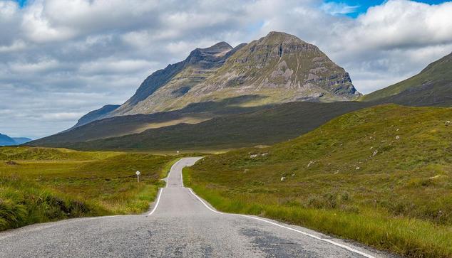 Single track road and a mountain.