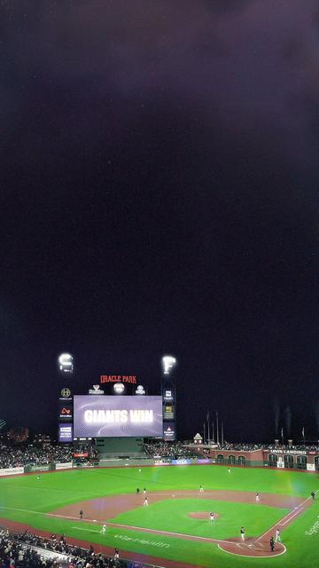 A shot of the Oracle Park with Giants Win on the scoreboard