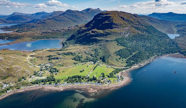 Aerial shot of sea and mountains.