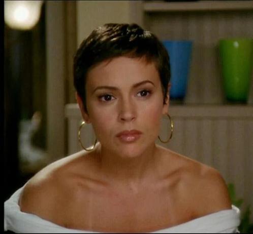 alyssa milano as phoebe halliwell in gold hoops and a white halter with a perfect pixie cut