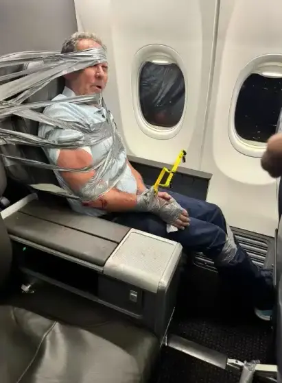 Lundeen restrained to his seat with duct tape and zip ties around his wrists, torso and head.
Photo via FOX 8