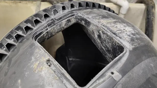 underside of litter robot globe showing how each tooth of the big cog that runs around it has a built in Filth Accumulator