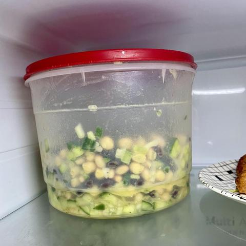 an ugly ass three bean salad in a plastic tub.