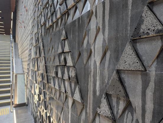 Feature wall with Maori inspired design and running water