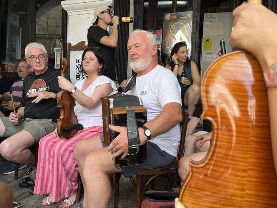 A row of musicians playing outside.