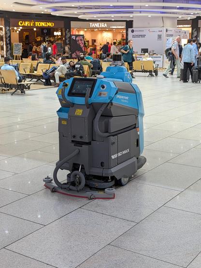 Peppermint robot floor cleaner robot, cleaning the floor at the airport.