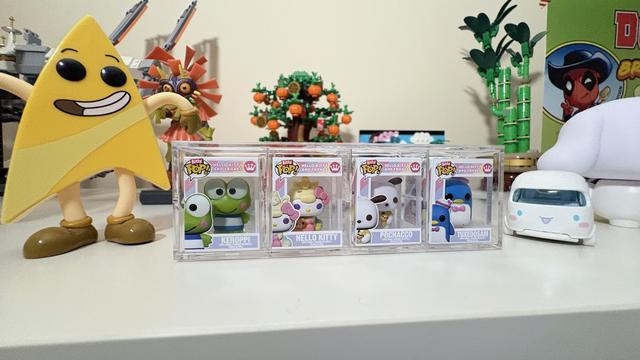 Sanrio Itty Bitty Pop Vinyl set, including Keroppi, Hello Kitty, Pochacco, and Tuxedo Sam. Badgey from Star Trek Lower Decks, and various LEGO sets are also visible in the background.