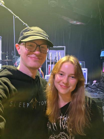 My daughter and I posing in front of the stage after the show
