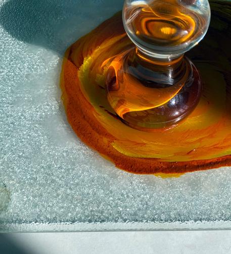 Homemade buckthorn lake, the colour of red-gold yolk, being mulled in preparation for printing