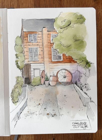 Sketch of a shingle house with wagon wheels in front of