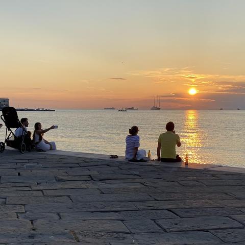 Watching the sunset sitting at the Molo Audace in Trieste, looking out to the gulf of Trieste