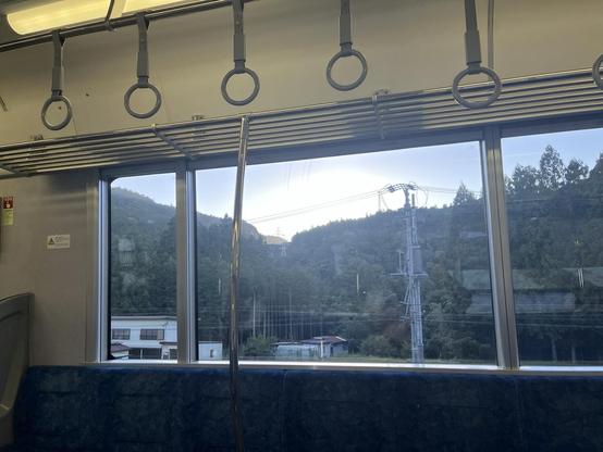 View out the train window on a mostly empty local train