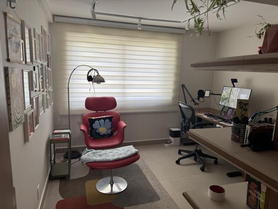 My actual office, replicating the layout I envisioned — but brighter and more cohesive. Several pieces (floor lamp, lounge chair — a tulip lounge chair, not an Eames) have a mid century design.