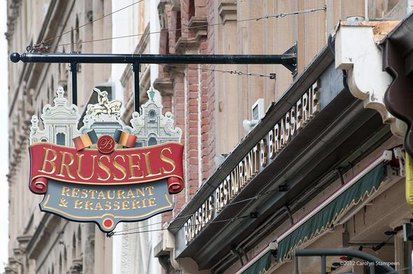 An image of a very pretty sign hanging over a business door.  It reads:
Brussels
Restaurant & Brasserie