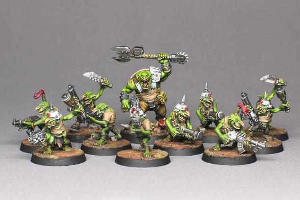 A full unit of 10 Gretchin and a modified Ork Boy proxying a Runtherd, all painted. Green seen, tanned clothes, white helmets.
