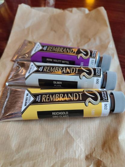 Three tubes of Rembrandt oil paints - metallic silver, gold for shiny plans, and transparent purple for shading