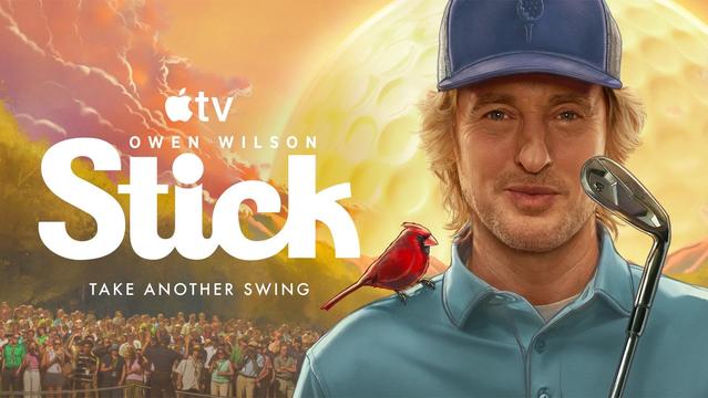 A man in a blue cap holds a golf club; a red cardinal perches on his shoulder. Text reads “Stick” with a crowd below.