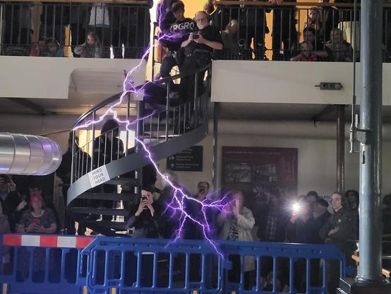 Large electrical discharge infront of a spiral staircase