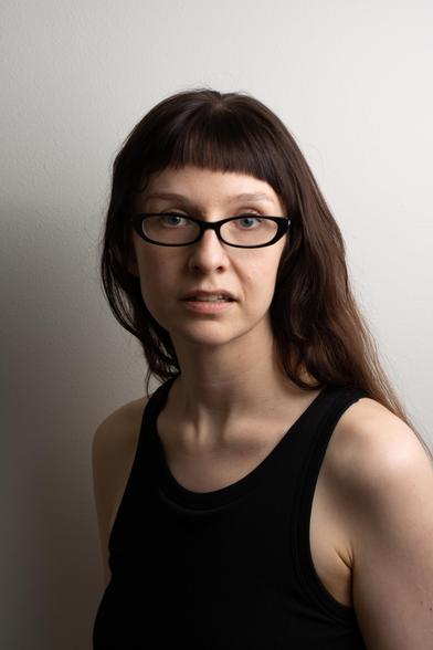 it's a photo of me against a white wall. there's a flash to my left and it's bouncing off another wall to my right. further editing could only improve it but it is already massively flattering just because of camera and lighting. you can see all my facial asymmetry or whatever but because it looks like a Good Photo, it all just reads much better