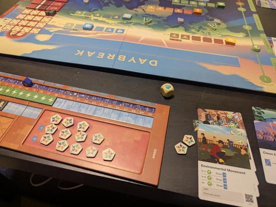 The board game Daybreak is being played on a table.