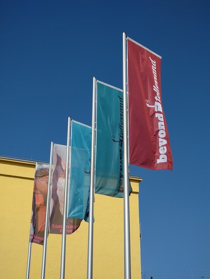 Colourful flags outside the venue.