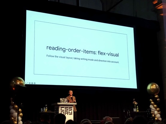 Rachel in front of screen with text:

reading-order-items: flex visual

Follow the visual layout, taking writing mode and direction into account.