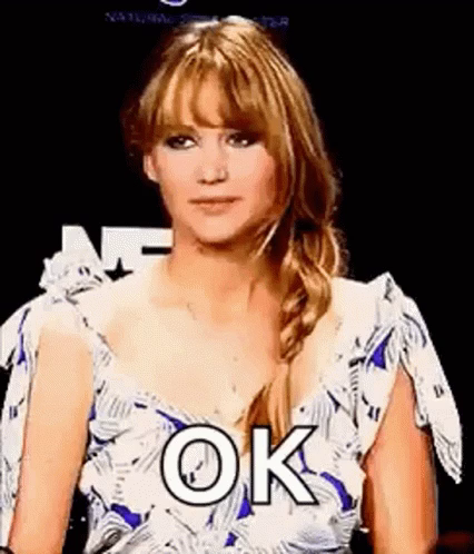 Jennifer Lawrence giving mouthing a sarcastic "OK" while giving a thumb up (the thumbs up is also sarcastic)