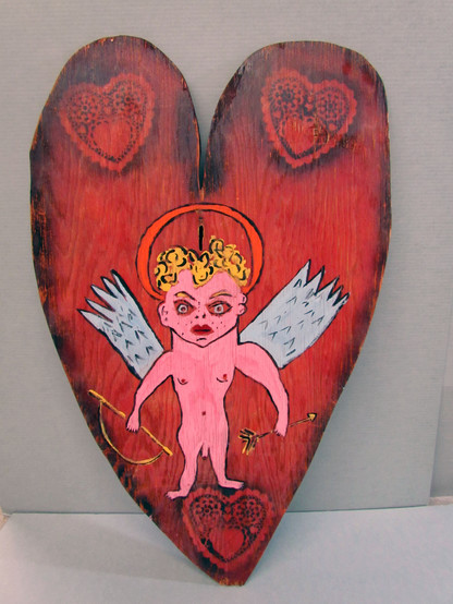Tomata du Plenty (born David Xavier Harrigan) (American, 1948 - 2000), heart with male Cupid. Painted wood cut-out. Georgia Museum of Art, University of Georgia; Gift of the estate of Anthony Corradino. GMOA 2016.163.