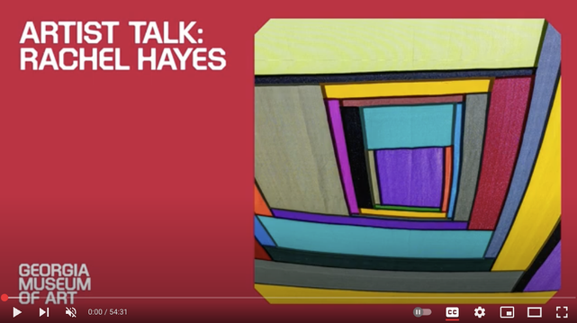 Screenshot of a YouTube video documenting an artist talk by Rachel Hayes, showing an example of her bright, colorful textile work.