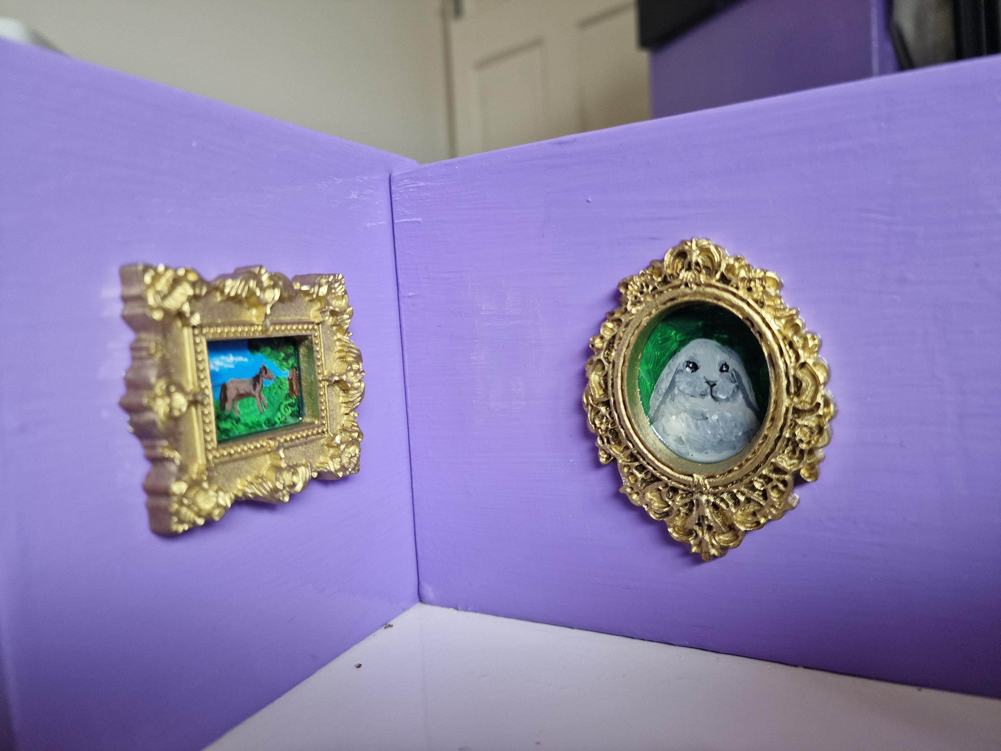 Tiny paintings on the wall of the baffle