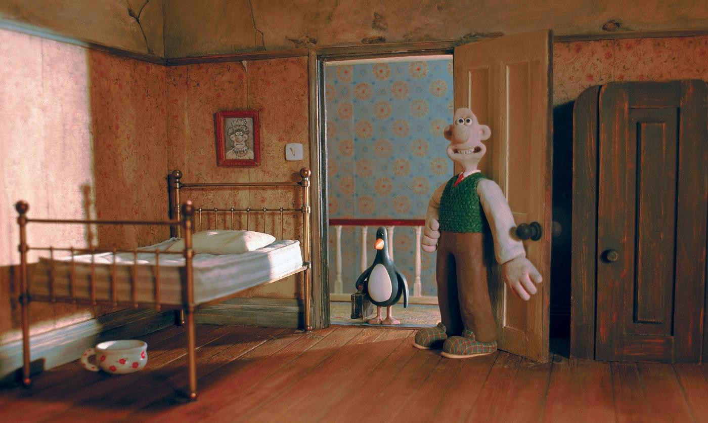 A frame from the short film Wallace and Gromit: The Wrong Trousers, the scene where Wallace shows Feathers McGraw the penguin to his new room in their house