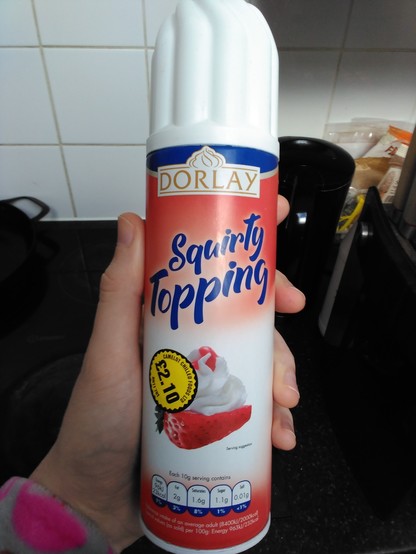 a can of squirty cream but it's labelled "squirty topping"