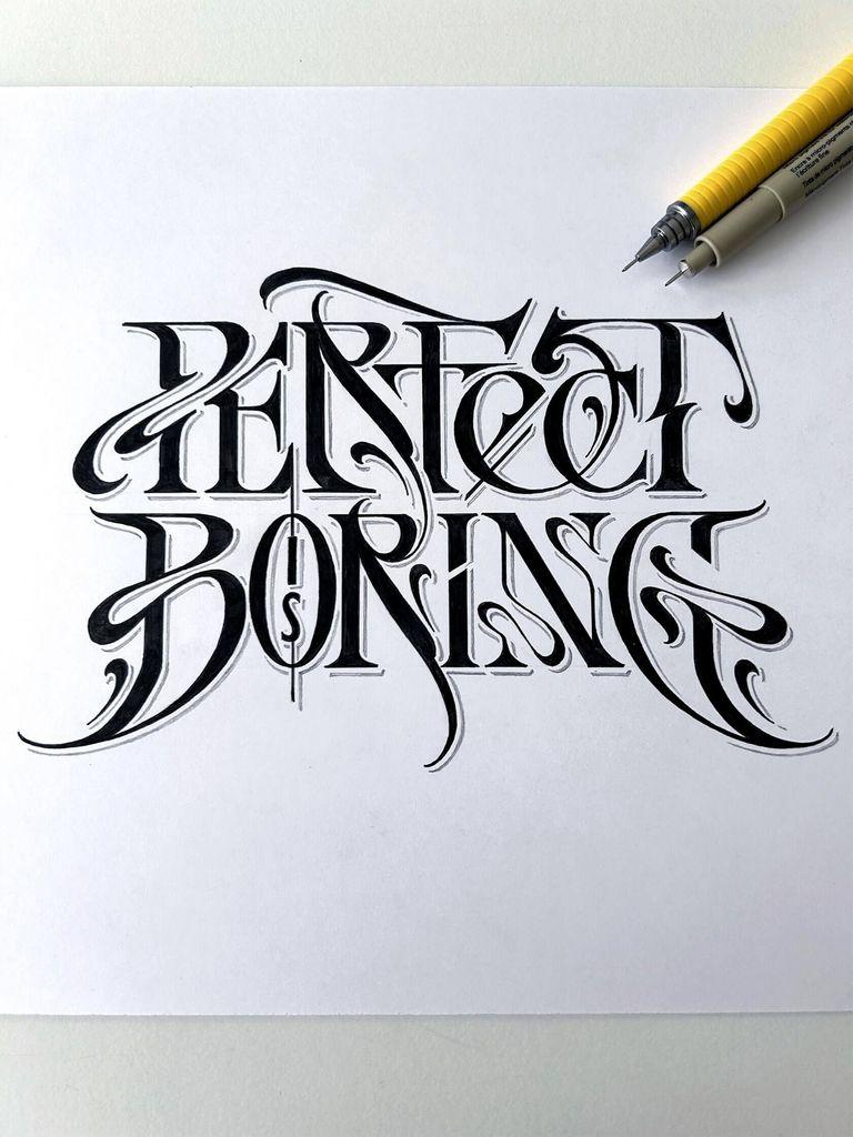 Black ink calligraphy on white paper reading "Perfect Boring" with two fine liner pens placed in the top right corner.