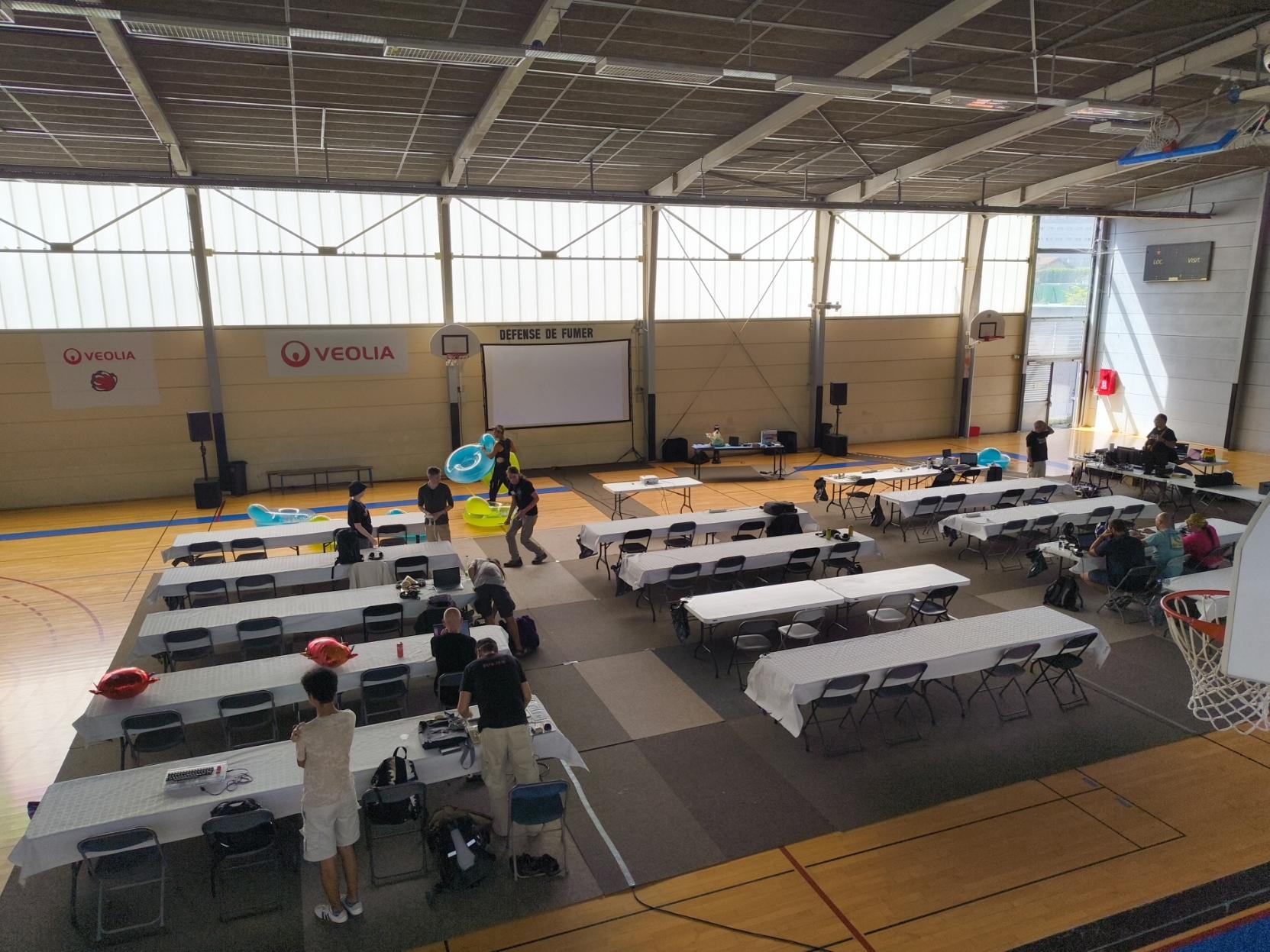 A photo from the basketball indoor field where the demoparty takes place. People start to arrive.