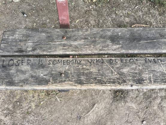 A bench with this inscription