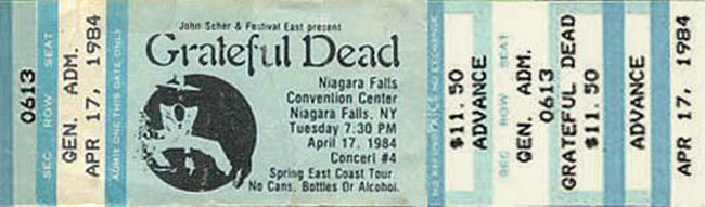 Grateful Dead mail order ticket on turquoise ticket stock with Shakedown Street dude