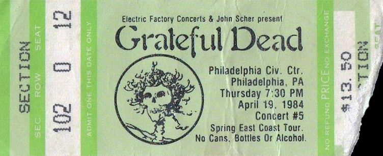 Grateful Dead mail order ticket on lime green ticket stock with skull & roses