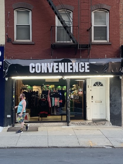 Black awning that says CONVENIENCE