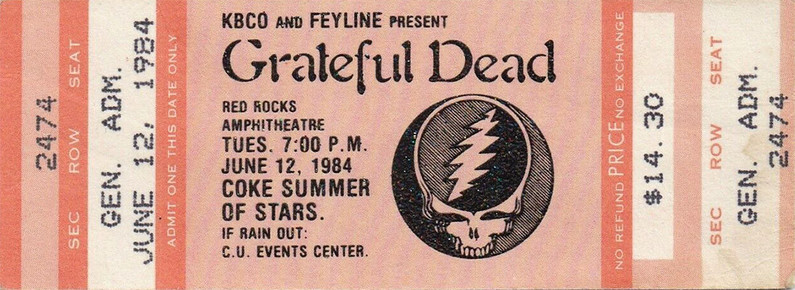 Grateful Dead mail order ticket on peach-colored ticket stock with Steal Your Face logo