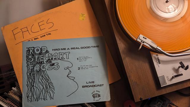 orange LP and sheet with drawing and track information