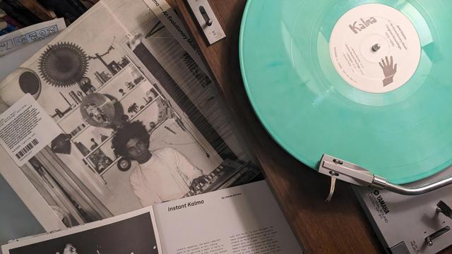 LP on turquoise vinyl plus liner notes titled Instant Kalma