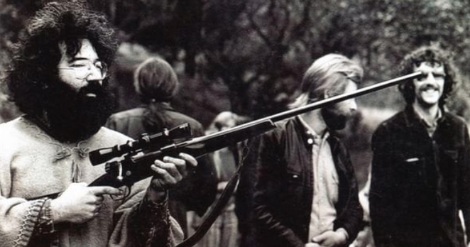 very high looking Jerry Garcia wielding long gun