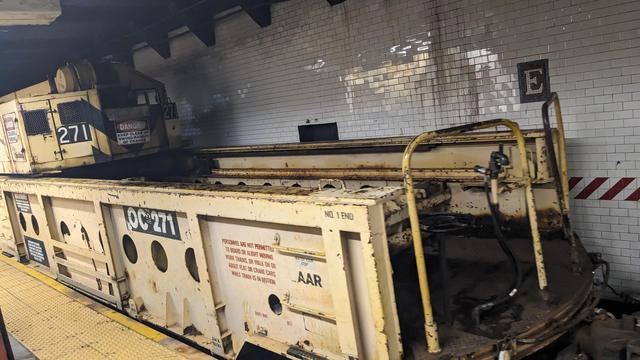 caboose of train pulling into subway station