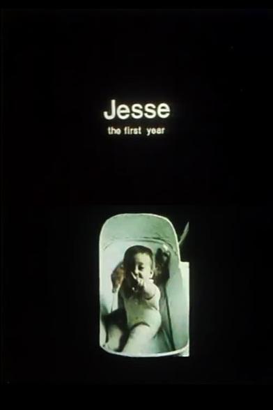 a baby in a bassinet (me!) points at camera, captioned Jesse The First Year