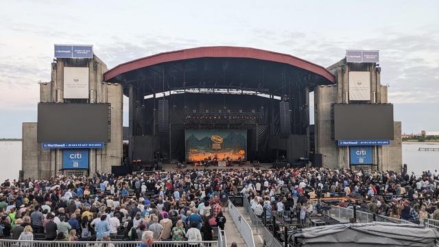 stage from a distance with Bob Dylan performing