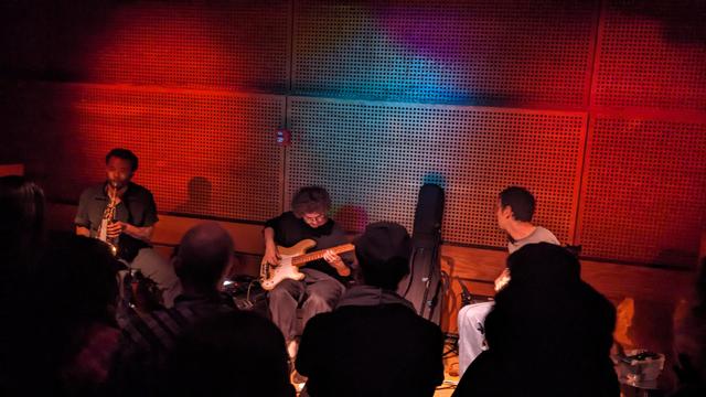 band with saxophone, bass, guitar