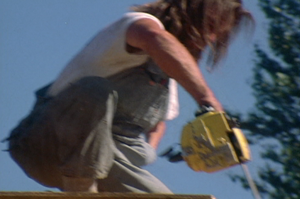 Al Strobel wields one armed chainsaw