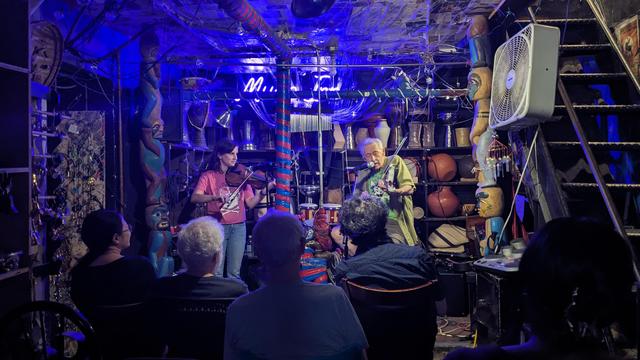 Peter Stampfel and Stephanie Coleman perform in a basement of esoteric instruments