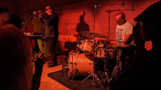 Rob Mazurek plays trumpet, Chad Taylor plays drums